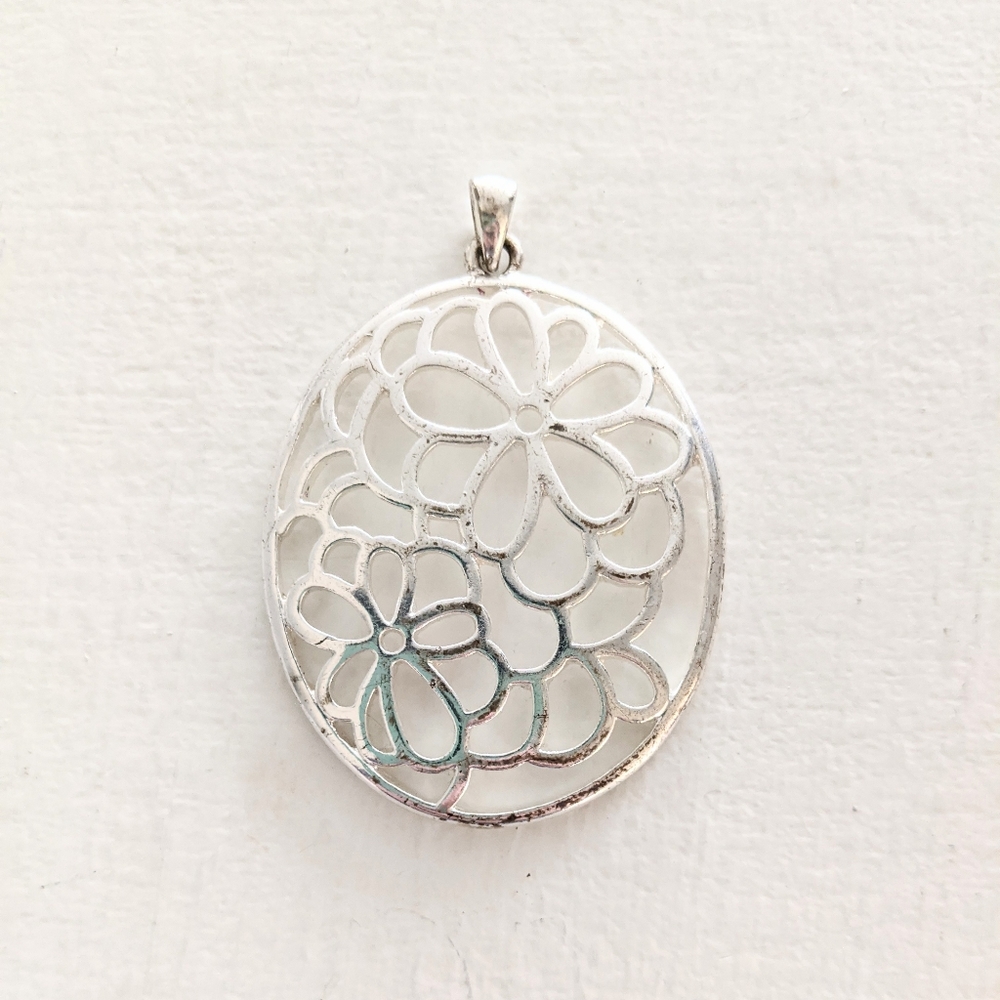 FREE with a purchase Silver Flower Pendant